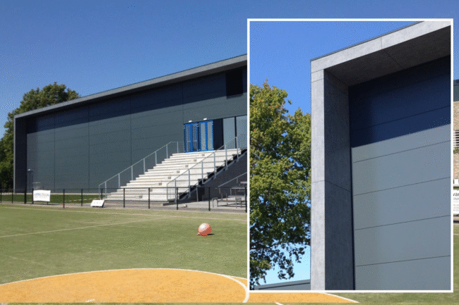 Sportaccommodatie in Leusden met metalen gevelbekleding en UniKern® zinklook dakoverstekken