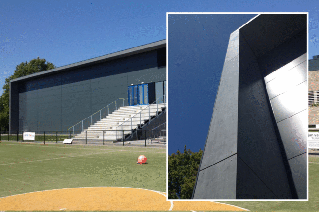 Sportaccommodatie in Leusden met metalen gevelbekleding en UniKern® zinklook dakoverstekken